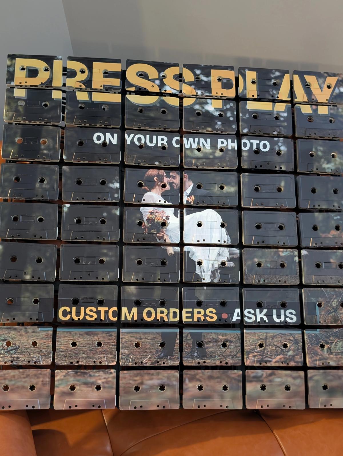 Custom-photo cassette mosaic demonstration with yellow Press Play lettering and a personal image