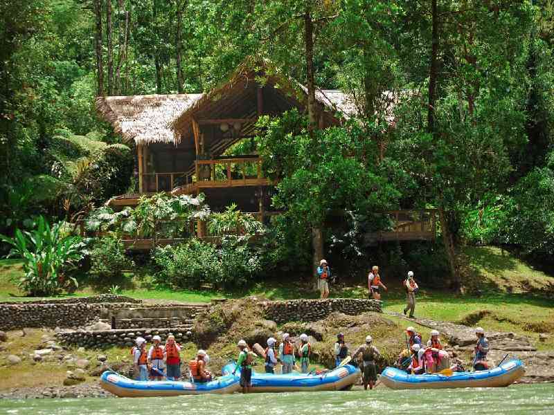 Tackle class III and IV rapids as you raft to a secluded rainforest lodge