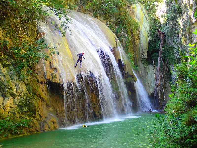 Experience thrilling canyoning with jumps, rappels, and jungle exploration