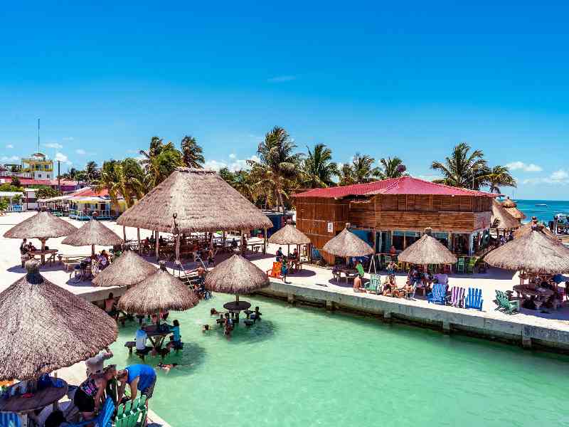 Relax into island life on Caye Caulker with beach bars, ocean views, catamaran cruises, and laid-back vibes.