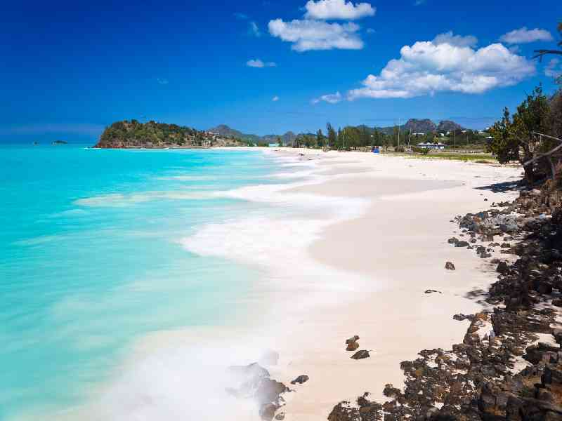 Visit stunning white-sand beaches with crystal-clear Caribbean waters perfect for swimming and relaxing.