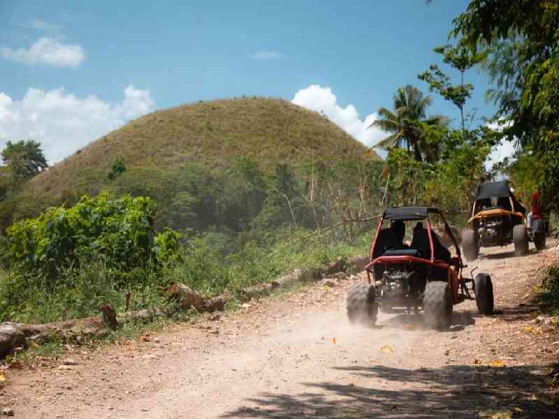 Embark on a sunrise quad biking adventure through the Chocolate Hills