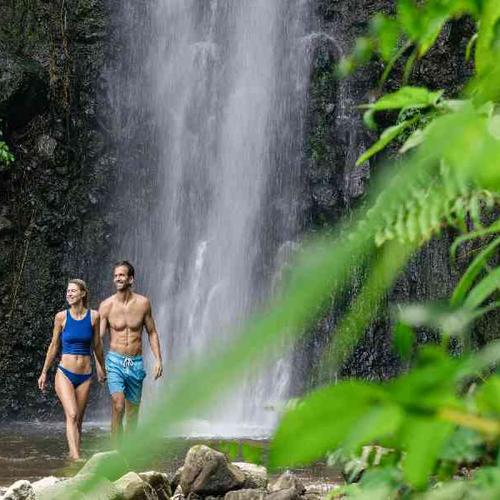 Swim beneath the twin cascades of Dark View Waterfalls before peak crowds Swim beneath the twin cascades of Dark View Waterfalls before peak crowds