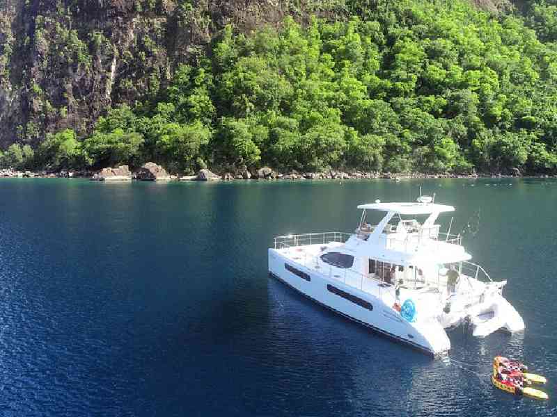 Cruise Saint Lucia on a catamaran with open bar and scenic coastal views