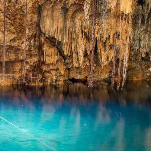Rappel down 40 feet to swim in a cenote cavern Rappel down 40 feet to swim in a cenote cavern