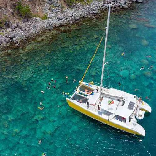 Cruise along the scenic coastline of Saint Kitts aboard a luxury catamaran Cruise along the scenic coastline of Saint Kitts aboard a luxury catamaran