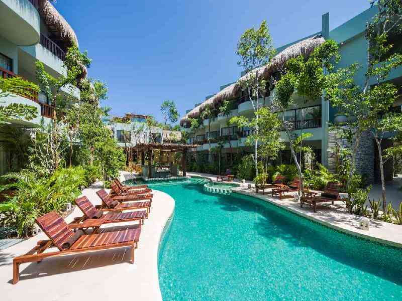 Stay at Kimpton Aluna, a boutique property hidden in the rainforests of Tulum