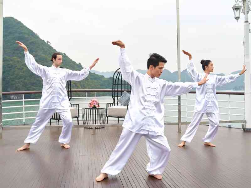Sleep aboard a luxury junk boat and rise with the sun for tai chi on deck
