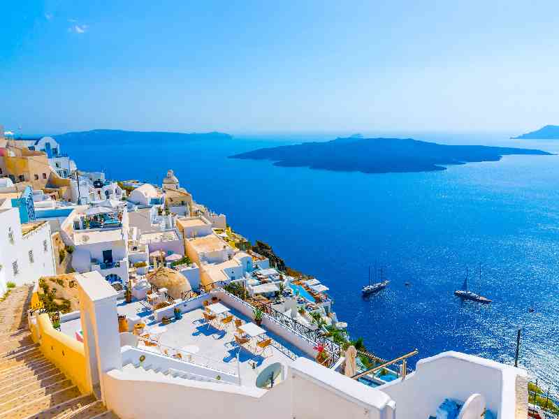 Explore Greece’s white-washed islands of Santorini and Mykonos
