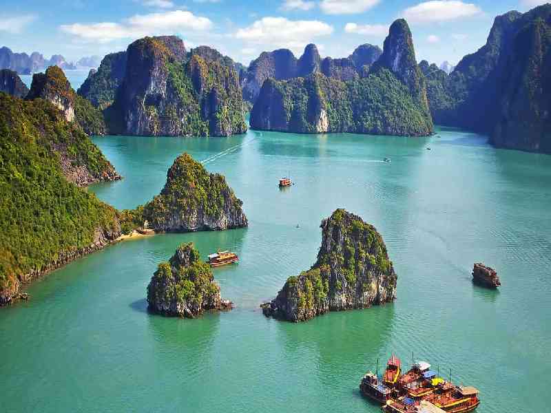 Cruise through the breathtaking limestone landscapes of Ha Long Bay and island-hop across the crystal-clear waters of Phang Nga Bay.