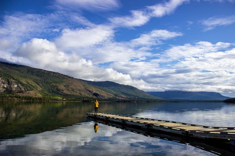 person on dock at lake