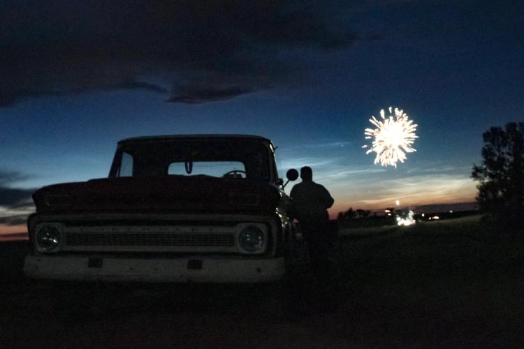 Old truck at night with fireworks