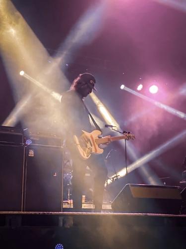 Guy on stage playing guitar 