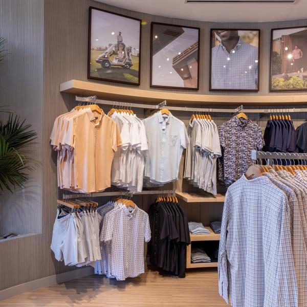 Display wall of polos and short sleeve shirts in the Mizzen+Main Southlake Town Square store