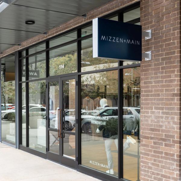 Exterior of the Mizzen+Main Domain Northside store in Austin with signage above the glass entrance