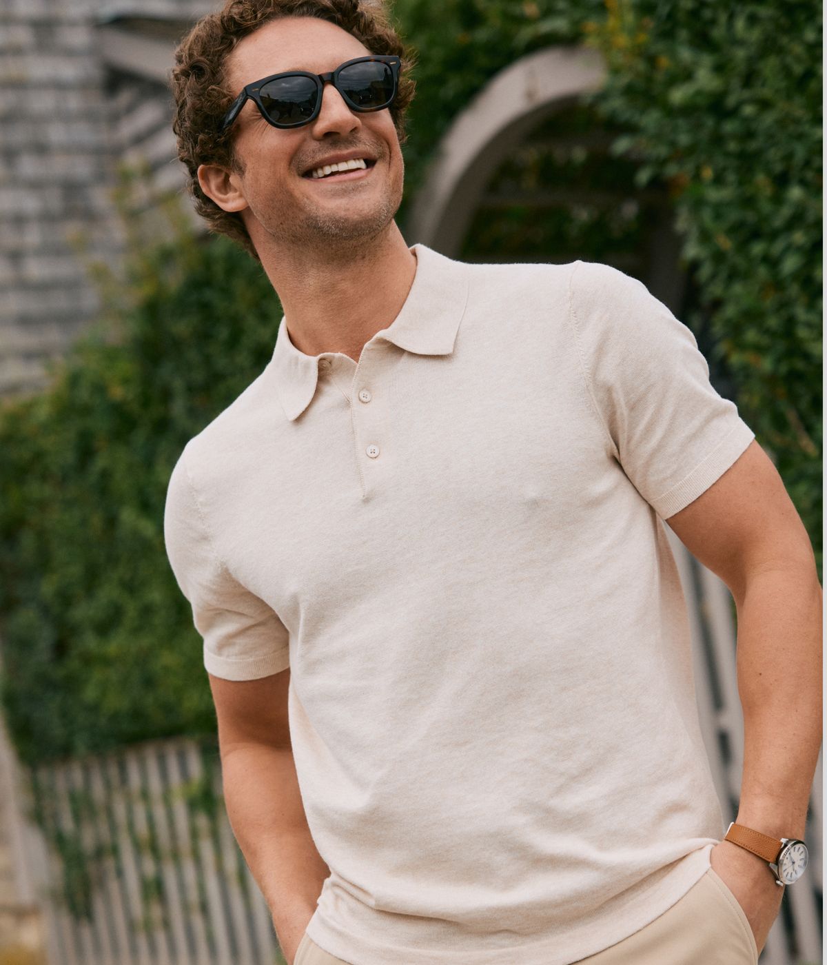 Man outside wearing the Oat Ashe Short Sleeve Polo.