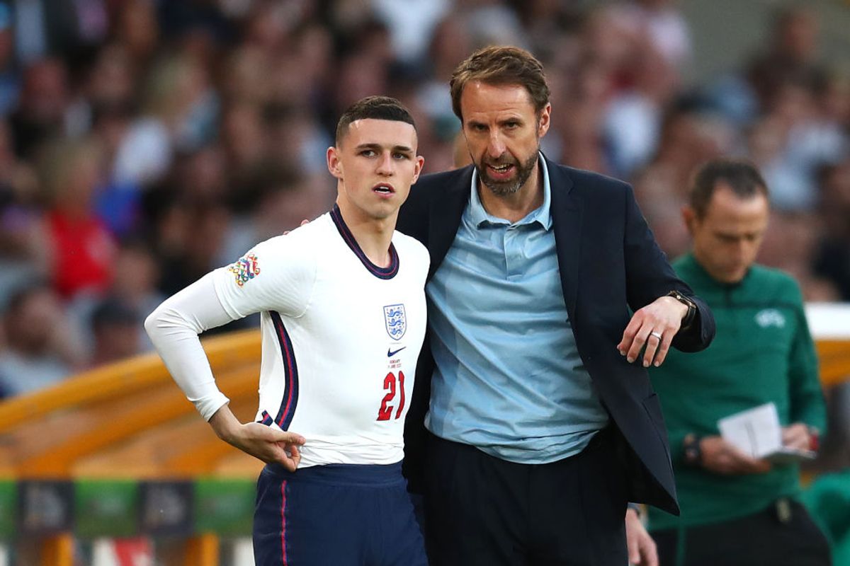 Gareth Southgate talking to Phil Foden about the benefits of My Team, probably