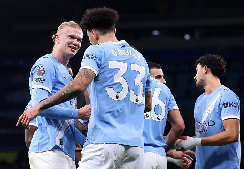 Nico O'Reilly of Manchester City celebrates with Erling Haaland
