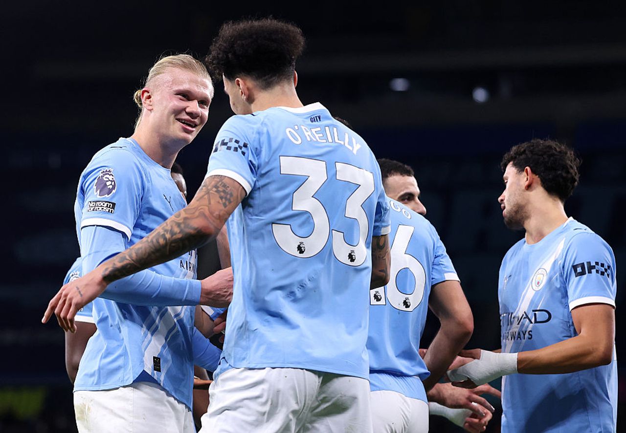 Nico O'Reilly of Manchester City celebrates with Erling Haaland