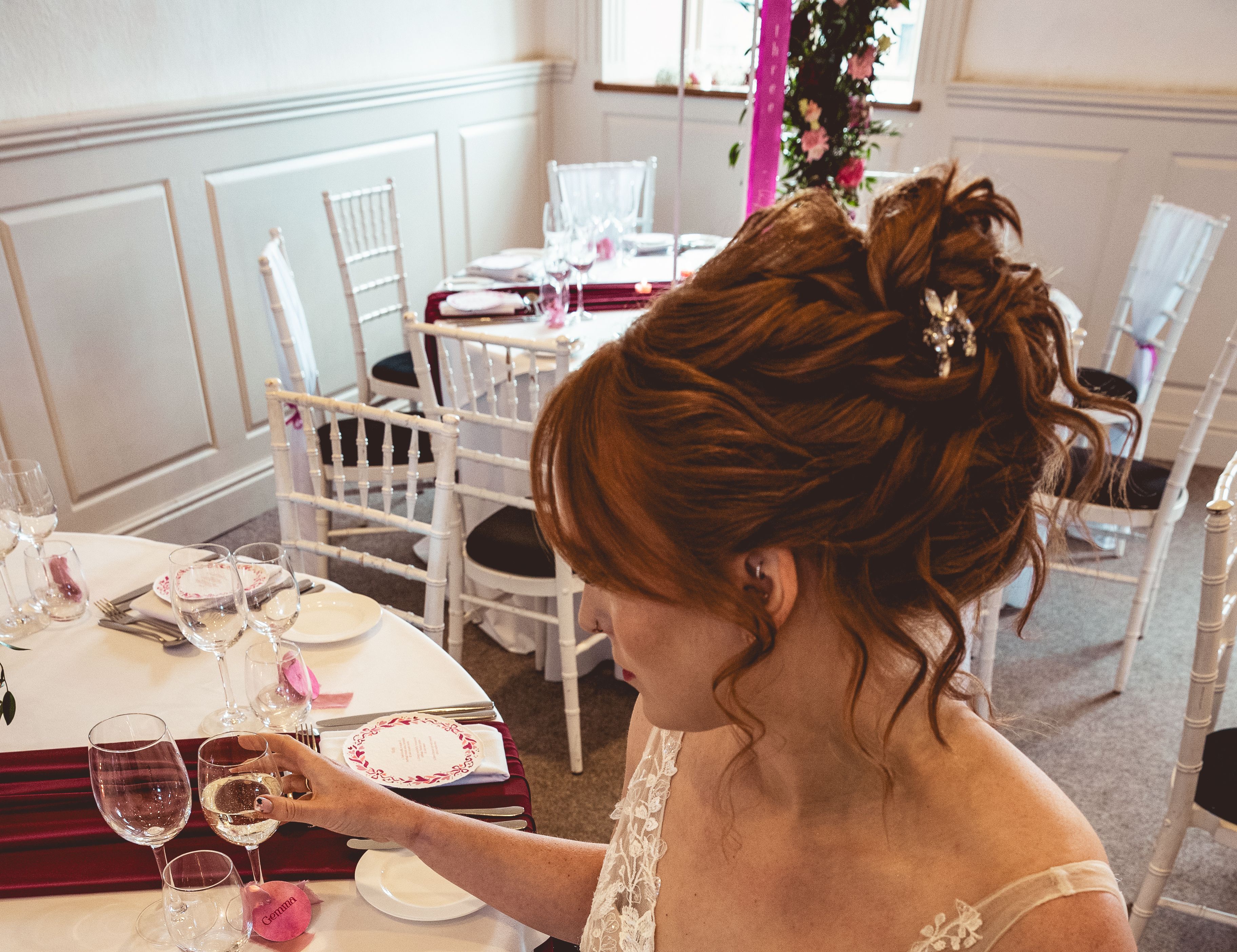 bride sitting at wedding day table