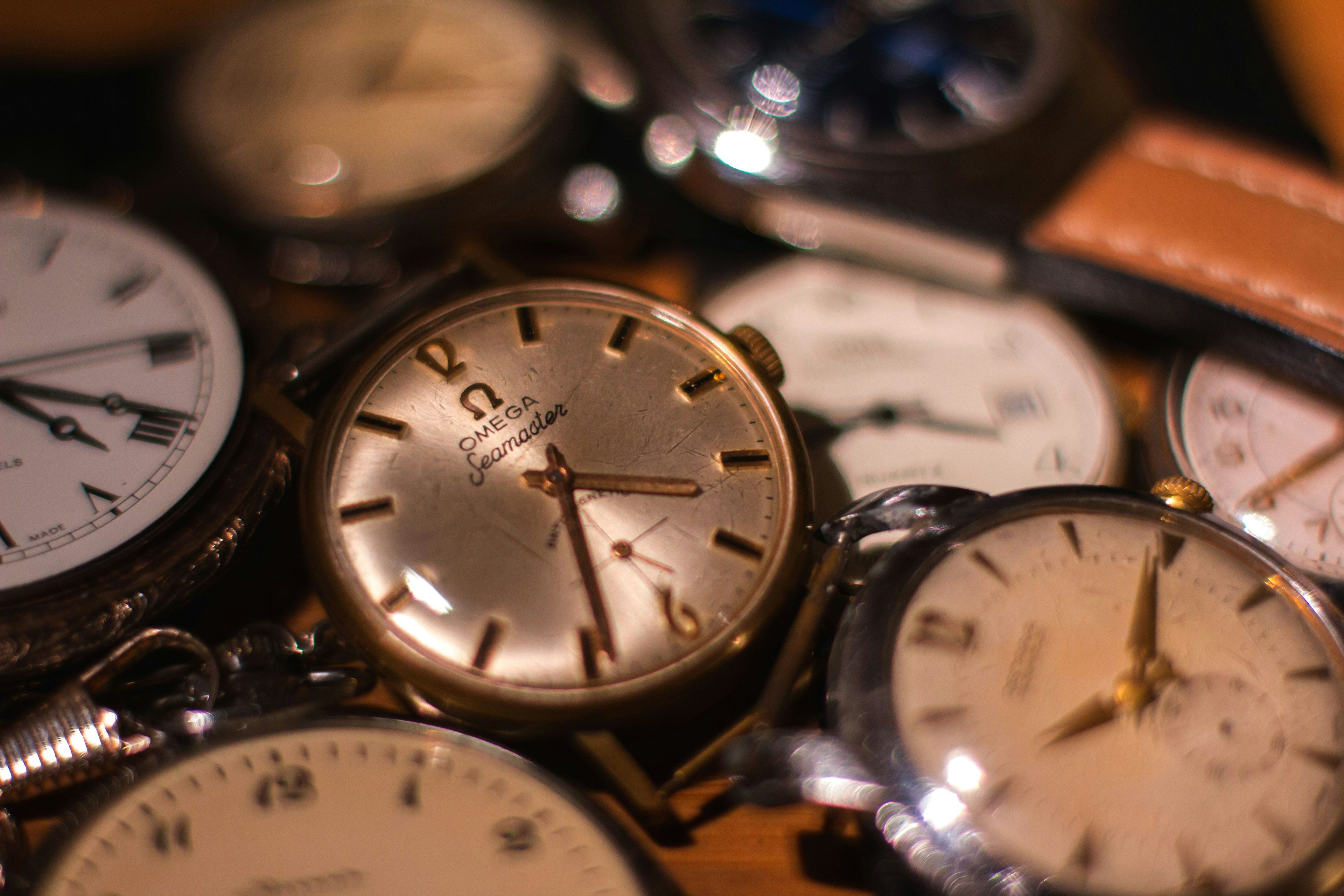 Vintage watch dials and movements gathered on a bench
