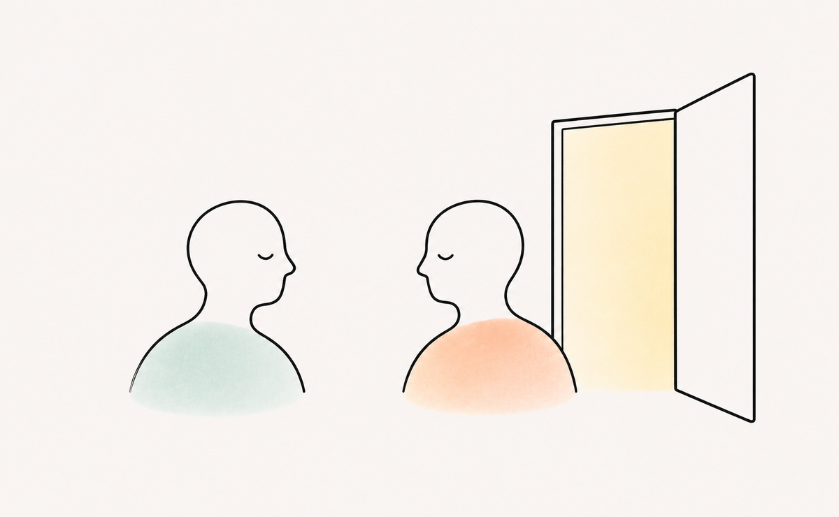 Two people face each other beside an open door, illustrating how freedom to leave can make connection feel more manageable.