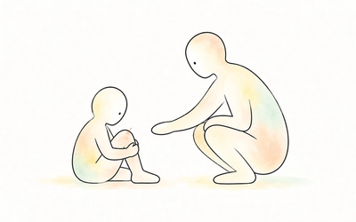 Recognising pain: A child holds a grazed knee while an adult crouches nearby, offering a gentle, open-handed response.