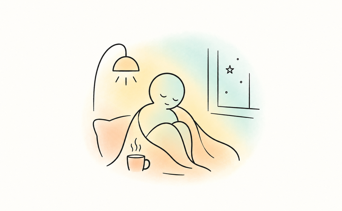Minimalist illustration of a person sitting peacefully curled up under a blanket, surrounded by soft peach, yellow and mint washes. A glowing lamp, steaming mug and quiet night-time window evoke hygge: warmth, familiarity, sensory comfort and a sense of safety.