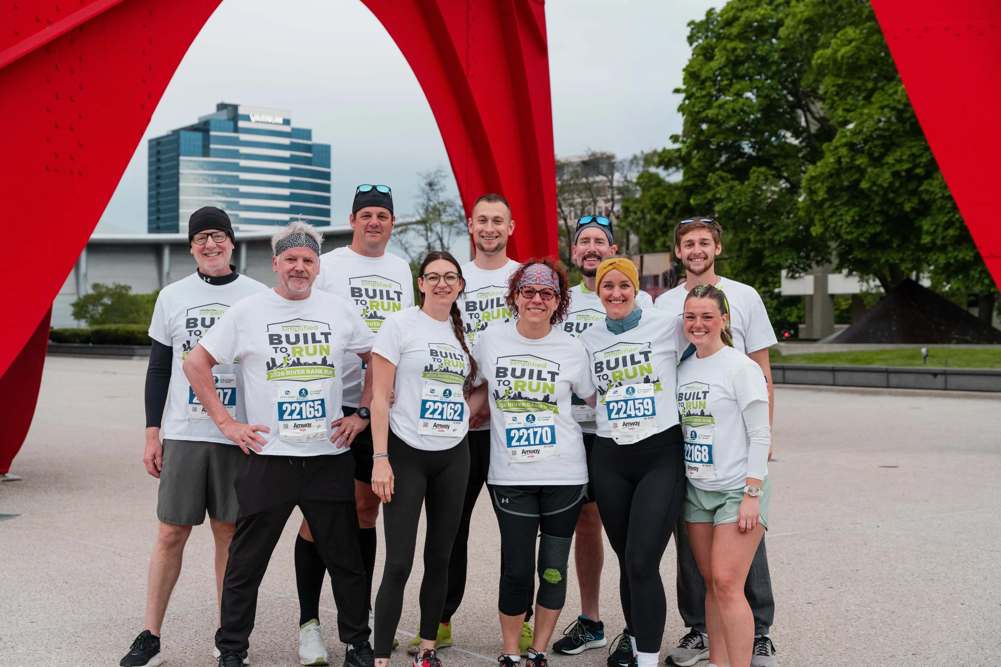 Construction Simplified team posing at calder plaza before Riverbank run