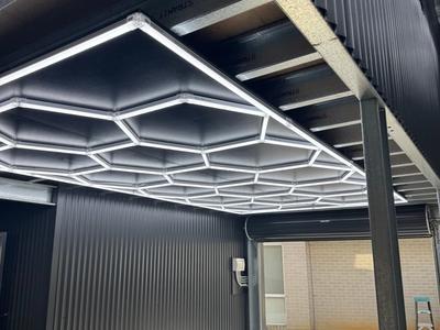 Atlas Power Solutions after photo of Feature hexa lighting installed in Just Sheds built man cave in Beerwah