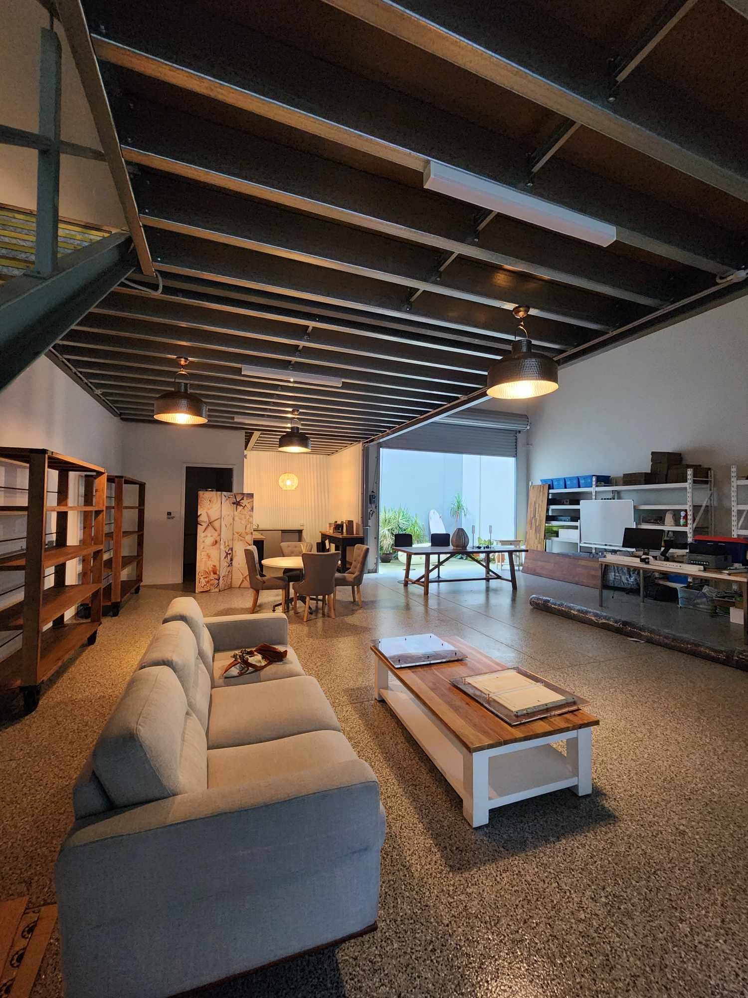Pendant and track lighting in furnished commercial studio