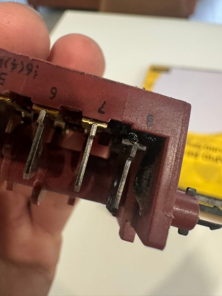 Burnt control switch removed from a 900mm oven at The Sway, Birtinya