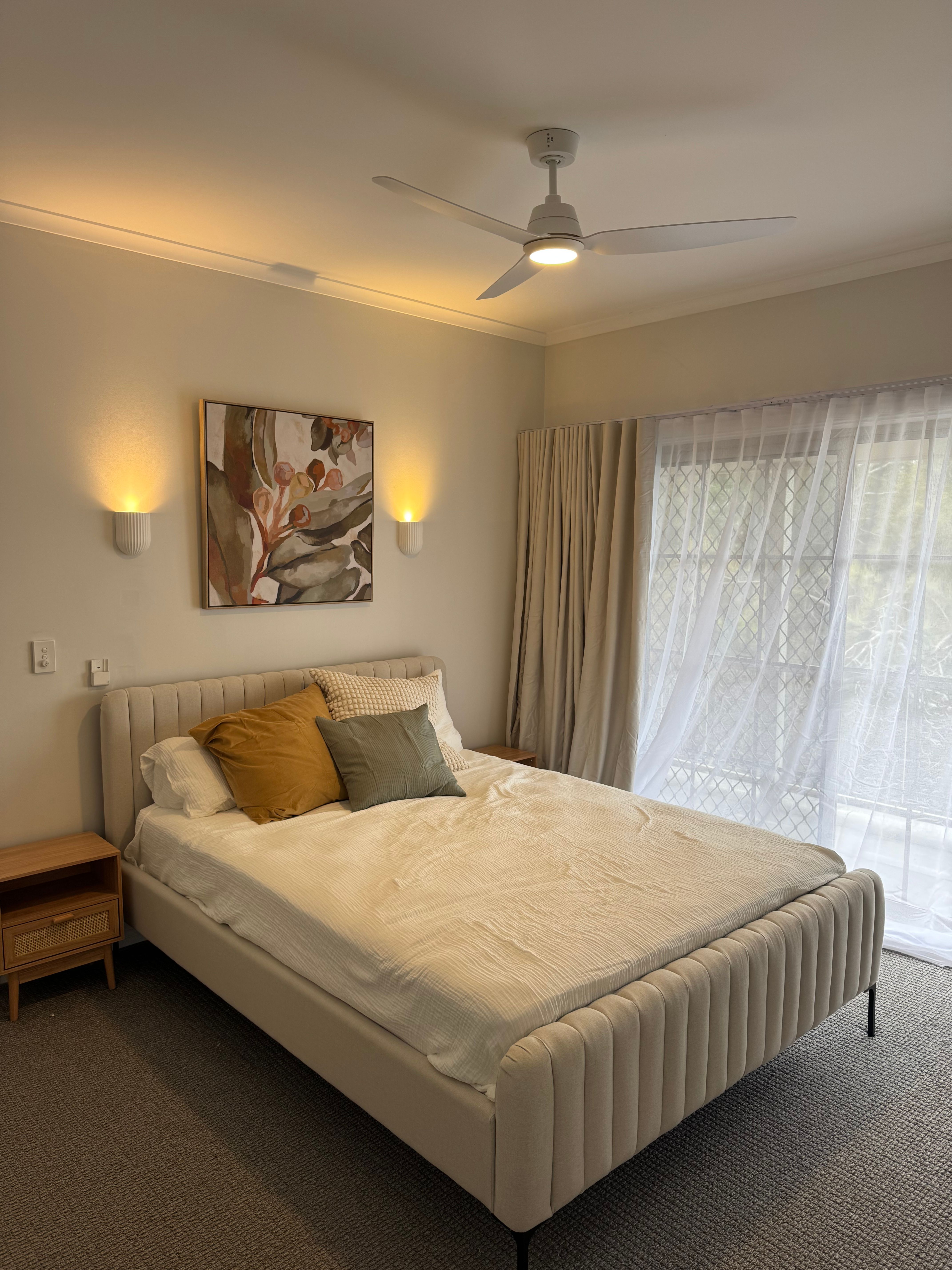 Ceiling fan and soft wall lighting in upgraded master bedroom