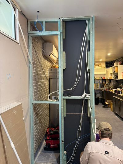 Cabled stud frame and a split above the fridge alcove during the Good Eats fit-out