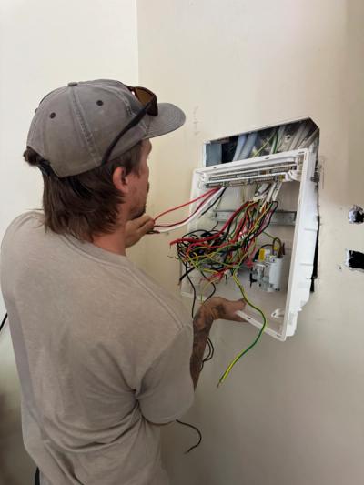 Flush-mount Clipsal sub-board being fitted at the Palmwoods home