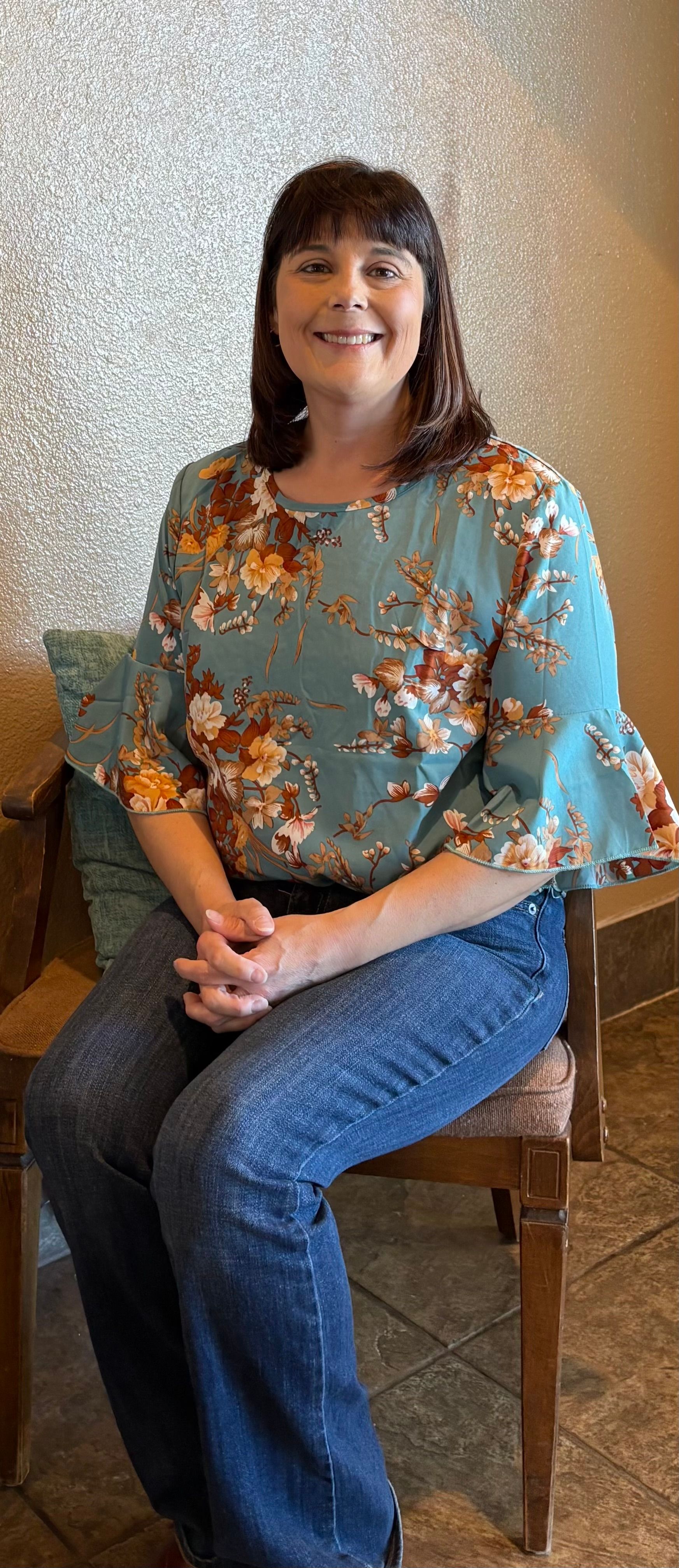 Jill Maher sitting in the entry way