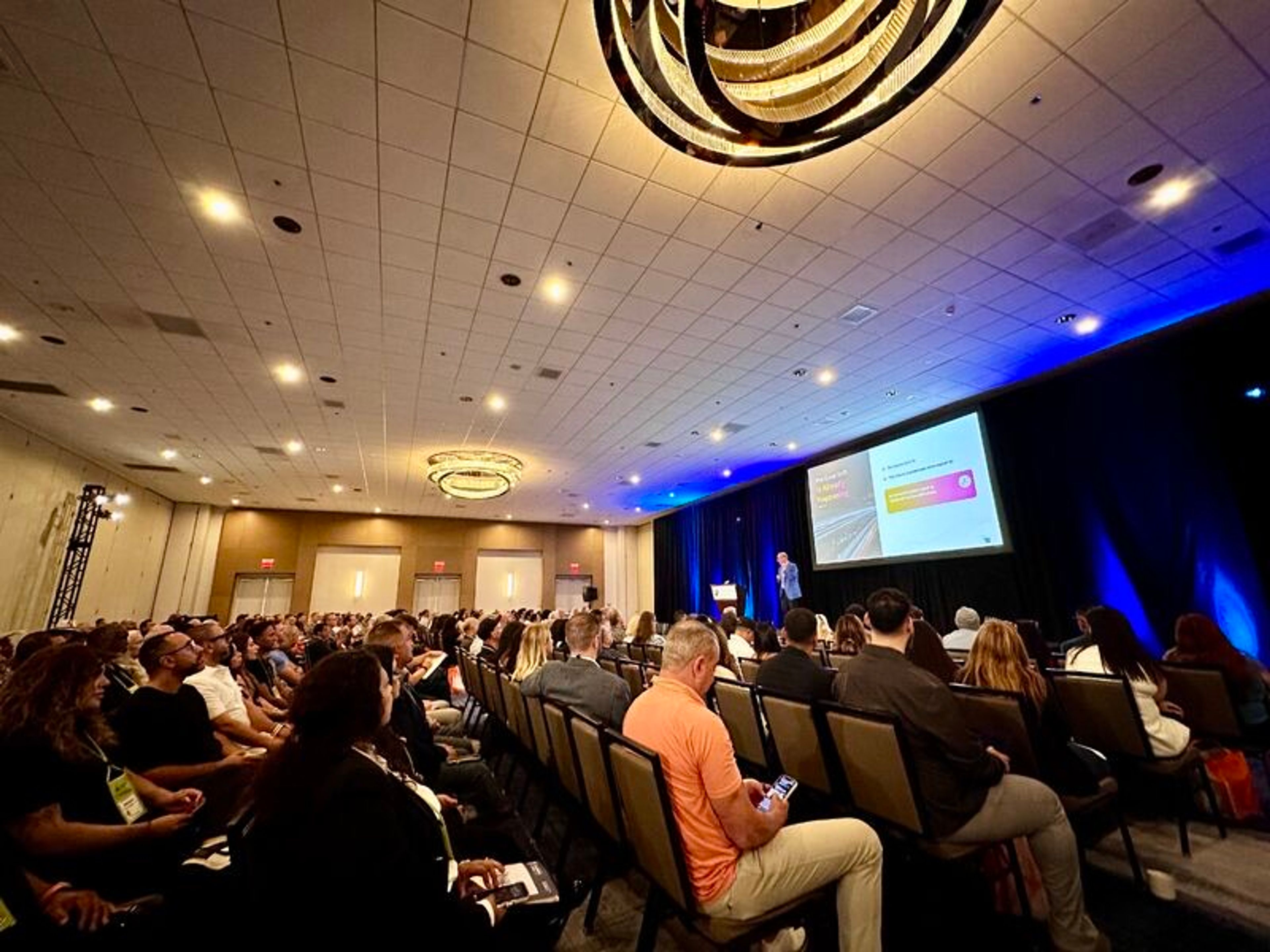 A full conference room during the keynote on AI leadership in insurance