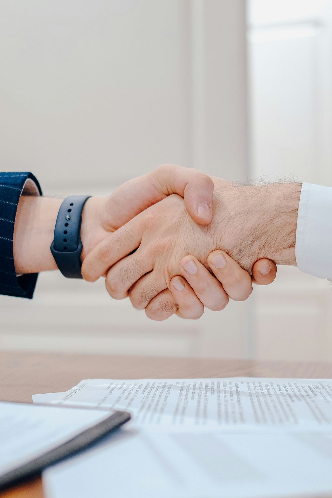 The people shaking hand as a sign of agree to term and complete the business deal.
