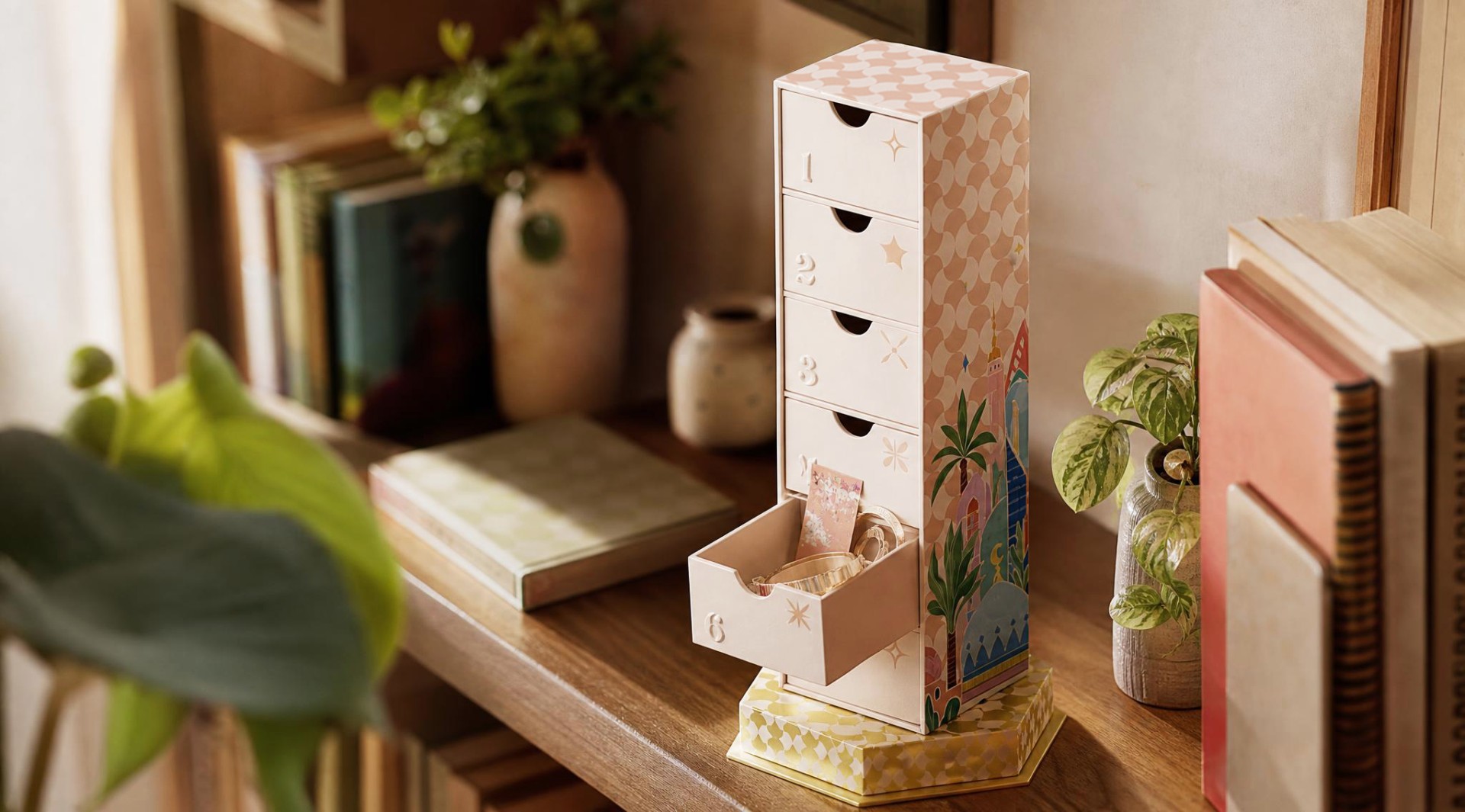 Drawer tower opened into a playful step-by-step unboxing arrangement