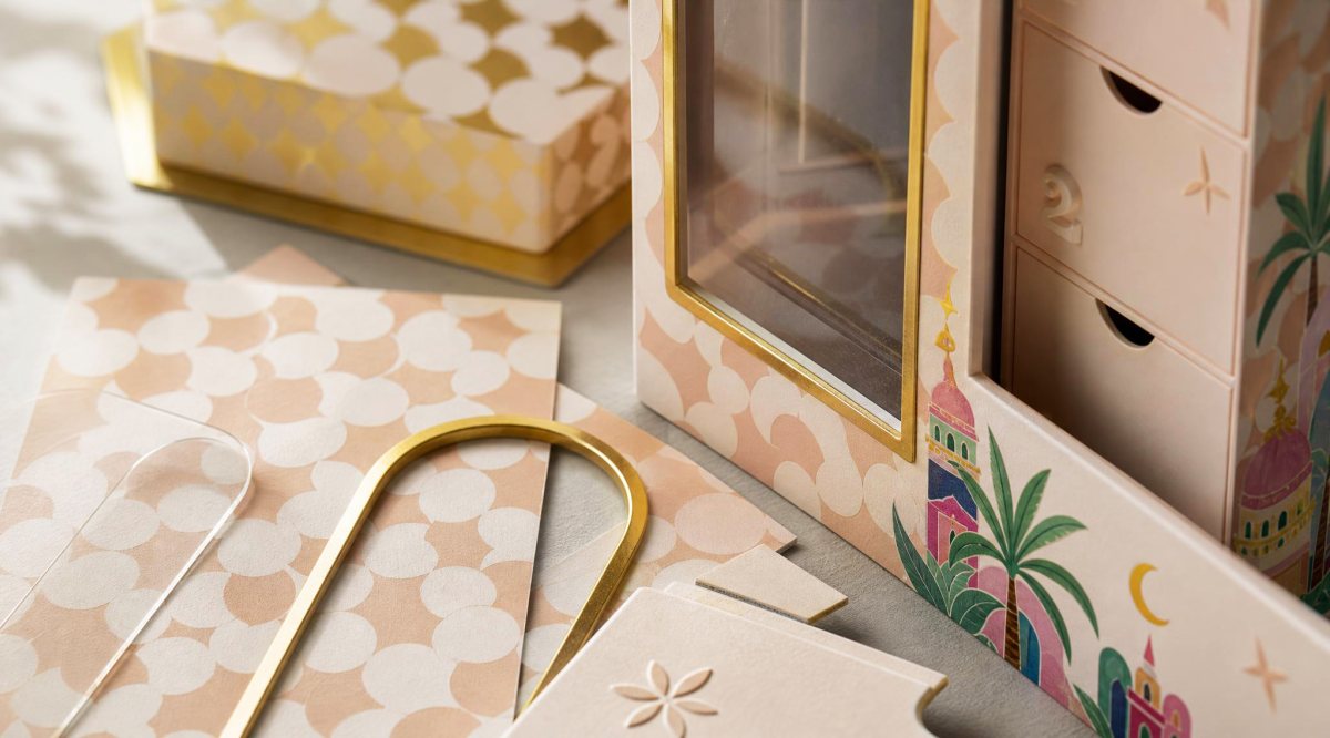 Material and surface study for the tower gift box, board, die-cutting and foil details.
