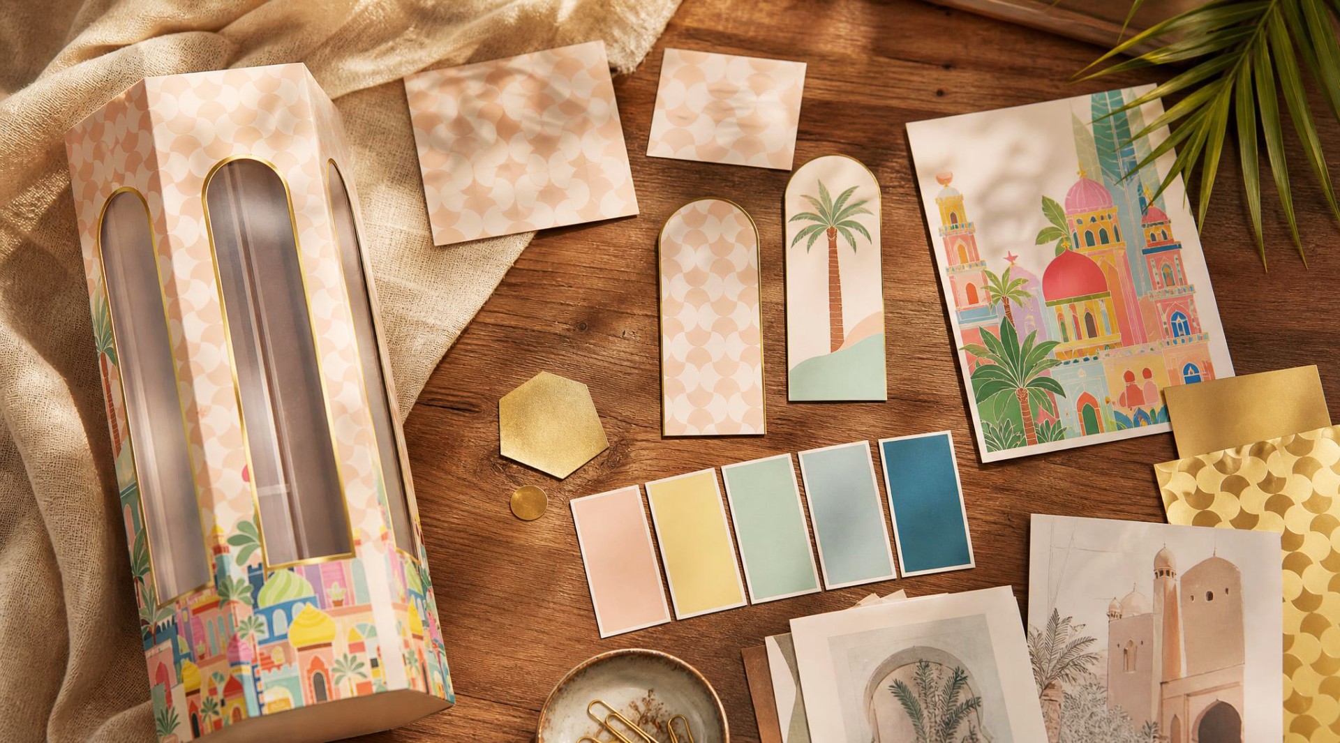 Soft-toned Ramadan packaging artwork with regional cityscape details