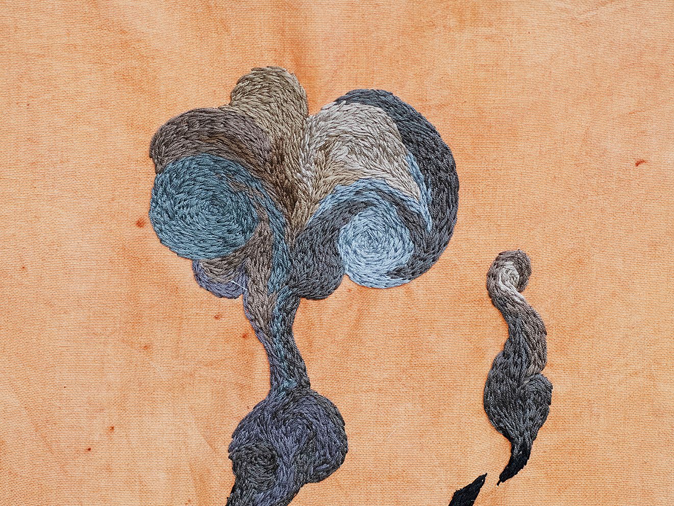 Quishile Charan, Burning Ganna Khet (Burning Sugarcane Farm), 2021, 153cm by 152cm, close up of embroidery detail. Technique: hand dyed textile, embroidery thread, cotton, hessian sacks. Textile is naturally dyed with avocado seeds. Image taken by: Raymond Sagapolutele. 