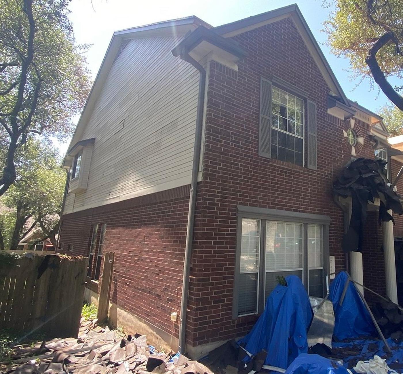 Before the siding & exterior painting project — home exterior in Anderson Mill, Austin
