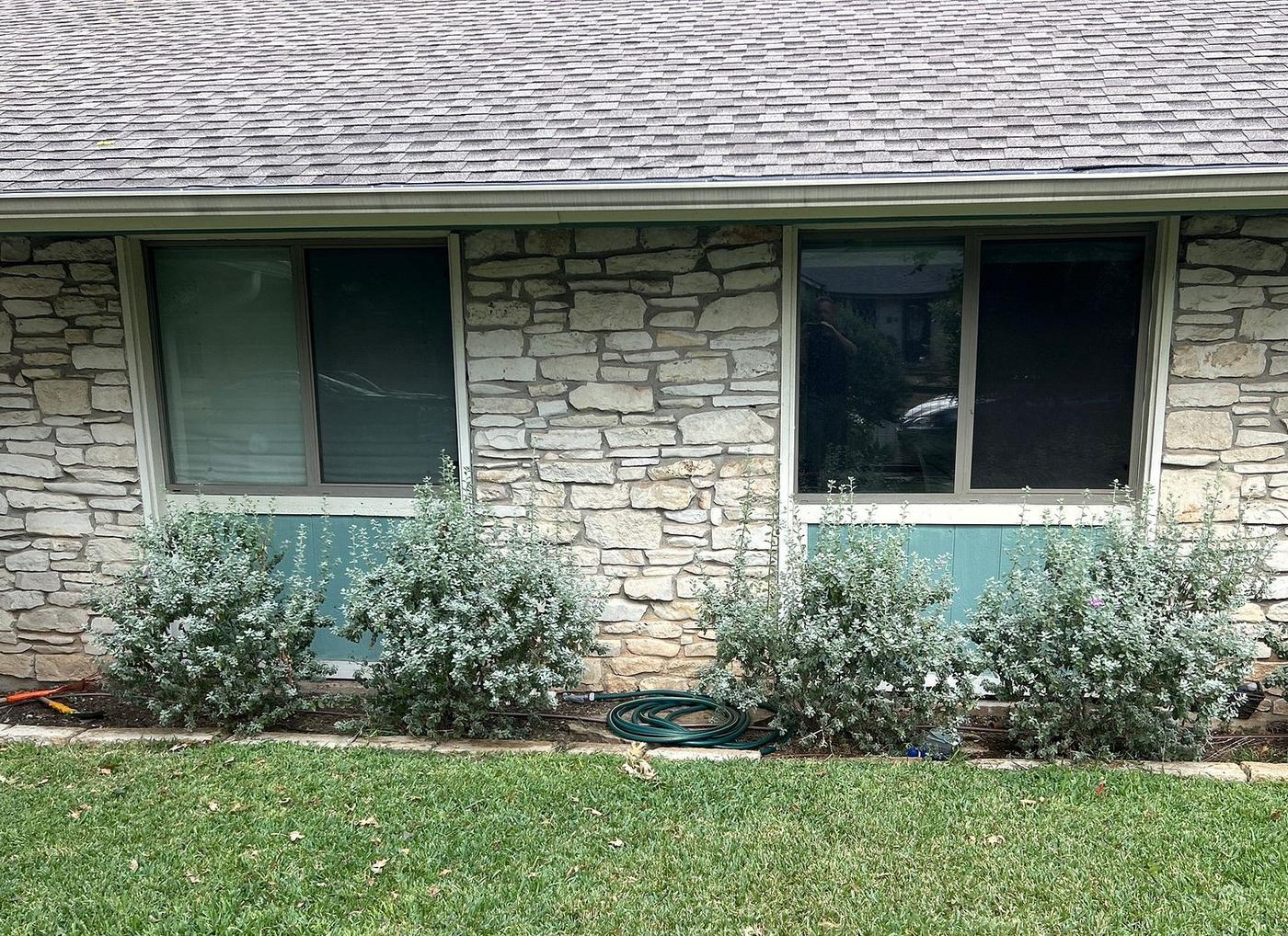 Before the siding project — home exterior in Highland, Austin
