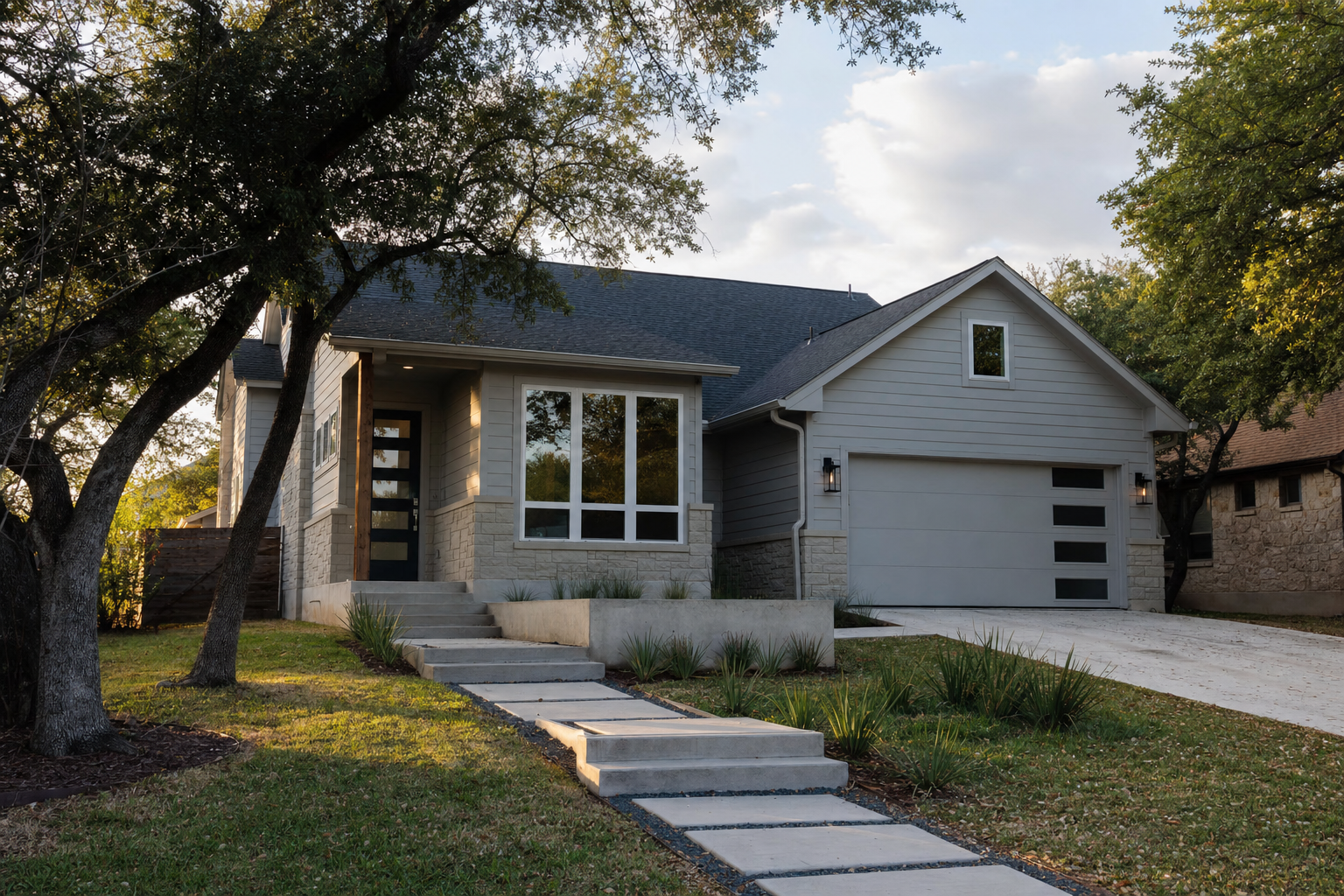 Finished fiber cement siding and window trim installation on an Austin home