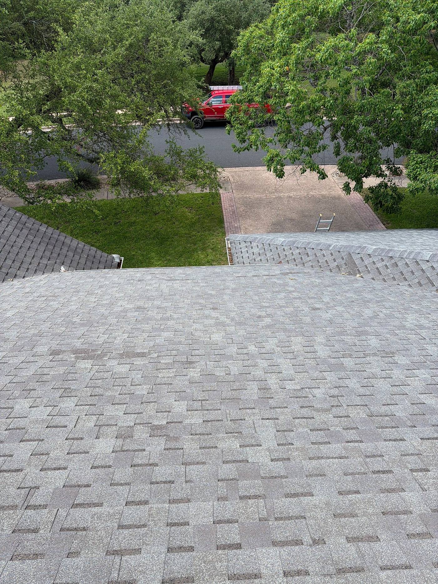 Before the shingle roofing & siding project — home exterior in Legend Oaks, Austin