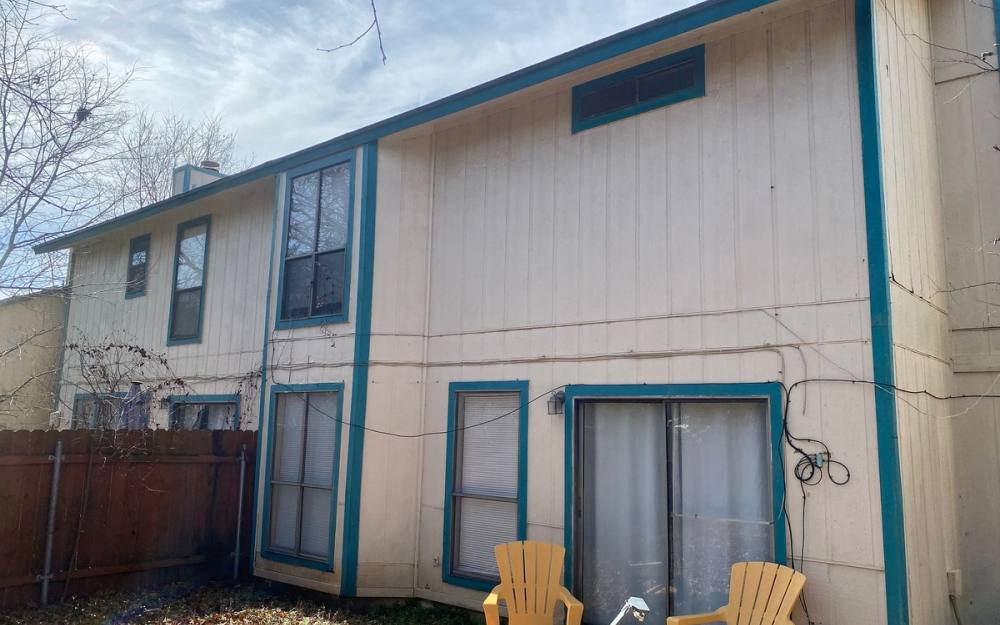 Before the siding & exterior painting project — home exterior in Tanglewood Forest, Austin