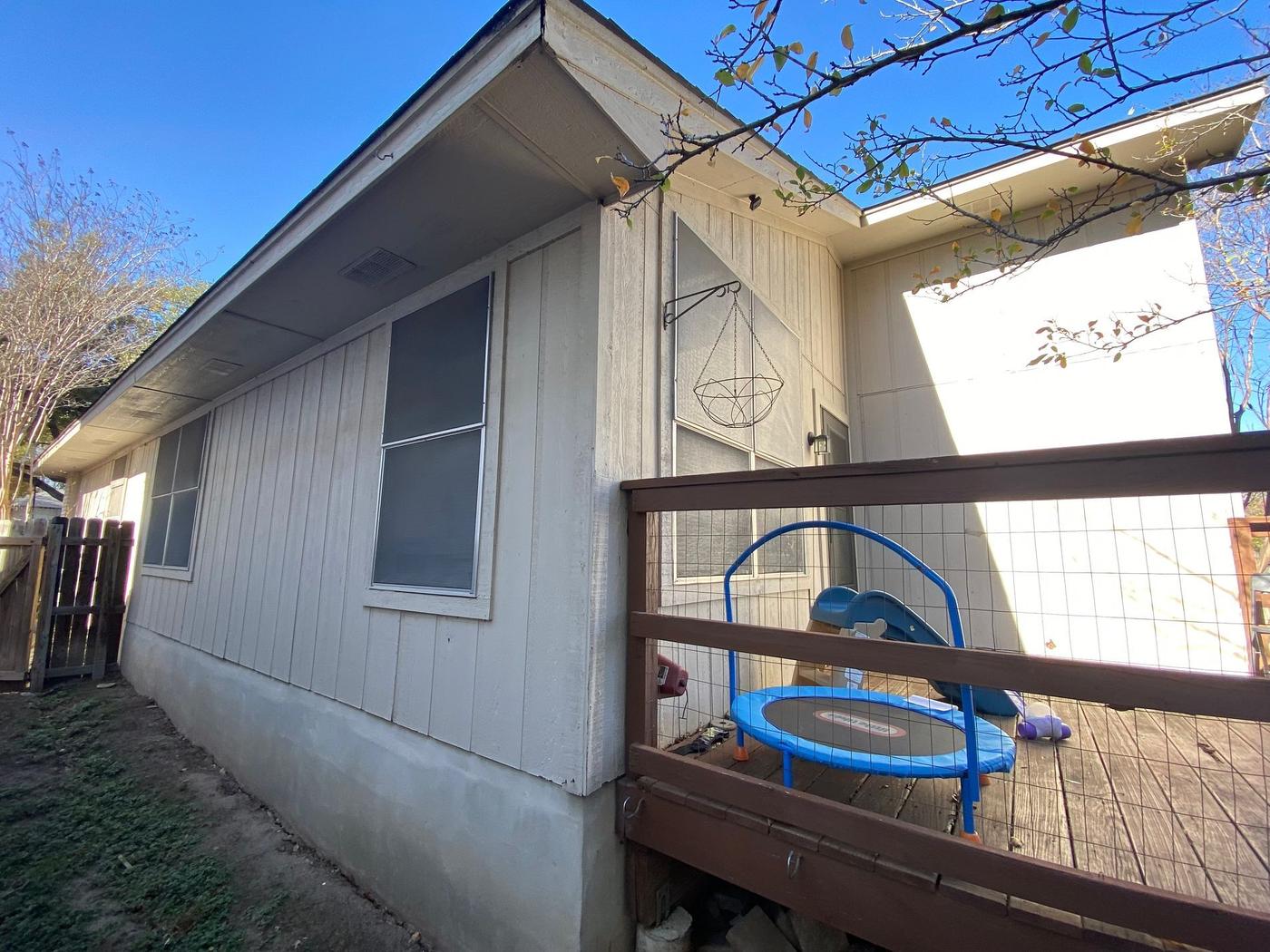 Before the siding & exterior painting project — home exterior in Parkwood, Austin