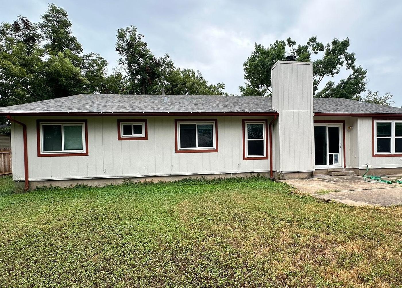 Before the siding & exterior painting project — home exterior in Village At Anderson Mill, Austin