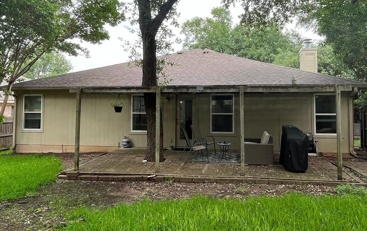 Before the siding & doors project — home exterior in Village At Western Oaks, Austin